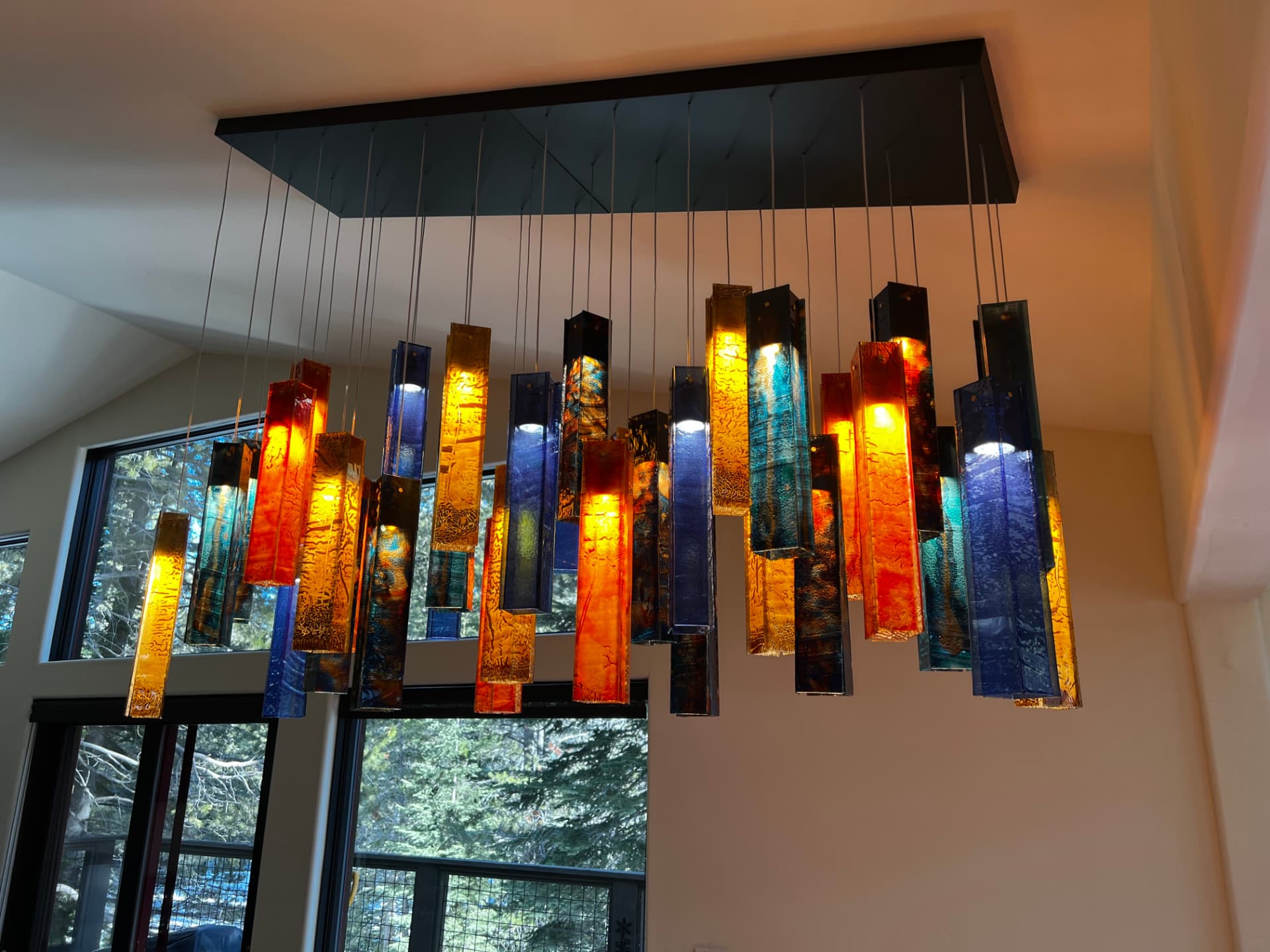 Custom art-glass pendant chandelier installed by Noble Electric